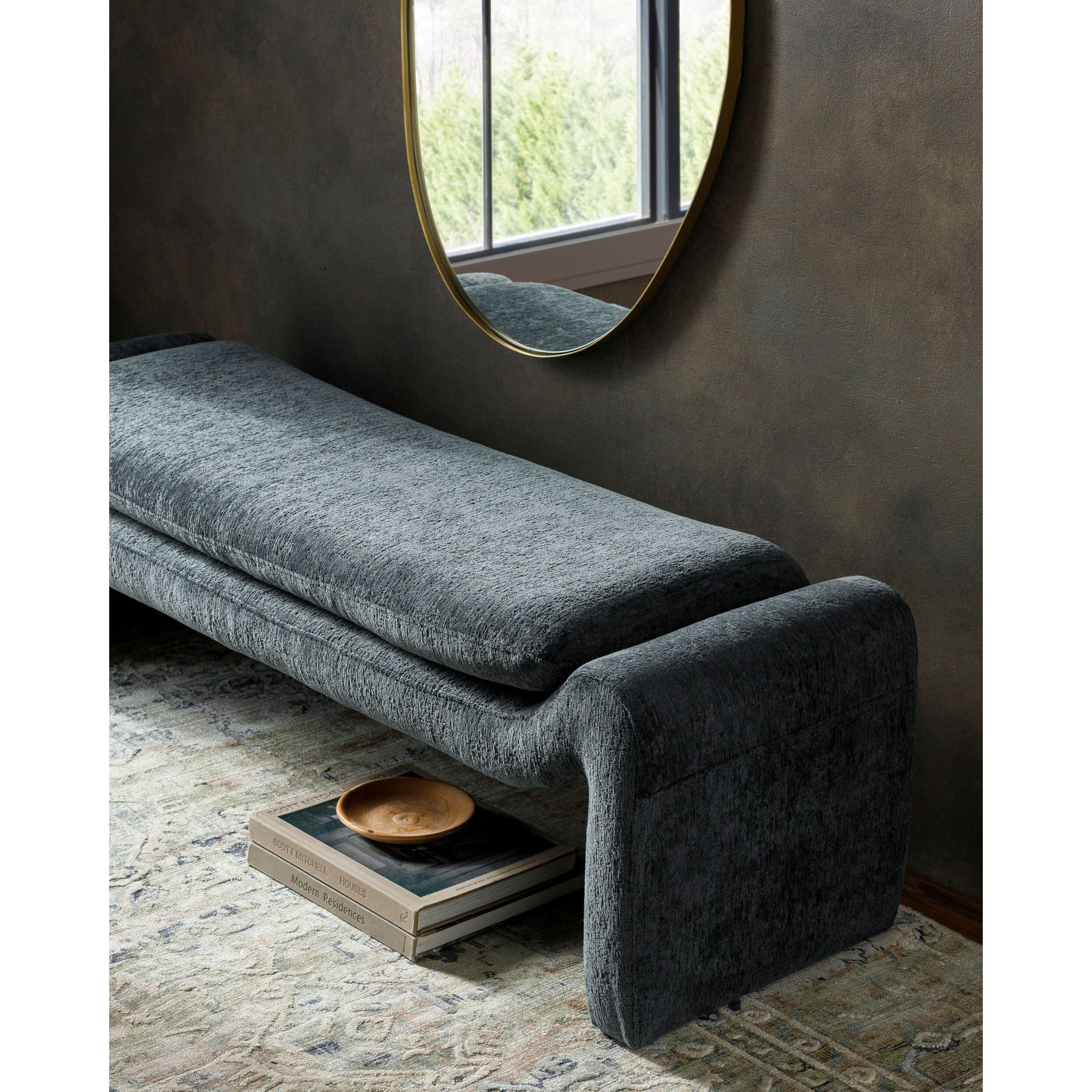 Modern benches and ottomans in fabric, wood, and leather with sculptural and minimalist designs
