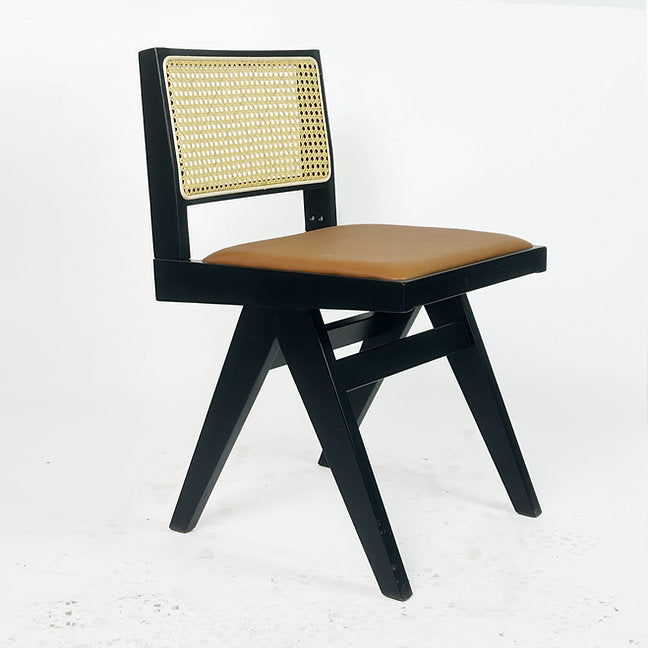 Side view of sculpted wood dining chair with curved backrest.