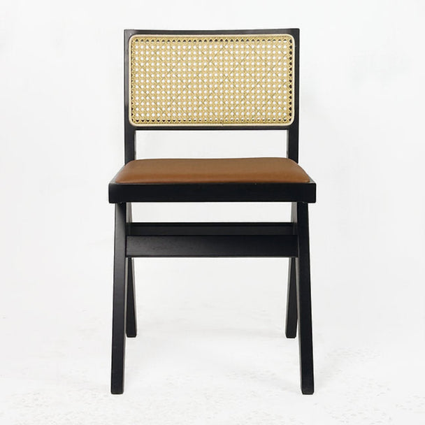 Terra dining chair with natural rattan back and cushioned leatherette seat.

