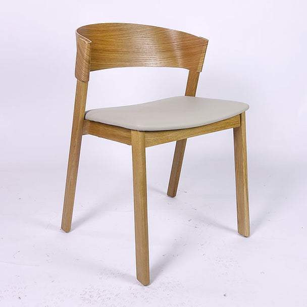 Scandinavian-style dining chair with curved backrest in light wood.