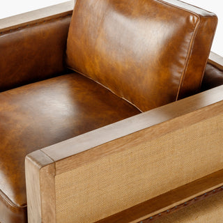 Close-up of a modern leather armchair with wood trim - premium quality craftsmanship furniture from Room to Bloom INC.